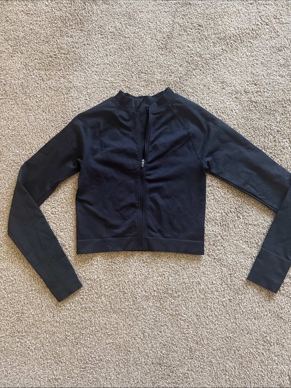 Women’s cropped running long sleeve zip up jacket. Size women’s S.
